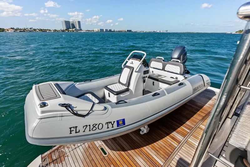 Fantasy Girl Yacht Photos Pics Luxury Absolute 75 Navetta 2025 yacht with Highfield tender on deck, ocean view.