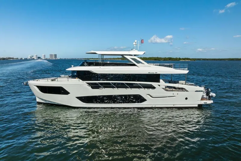 Fantasy Girl Yacht Photos Pics Luxury 2025 Absolute 75 Navetta yacht cruising on open water under clear skies.