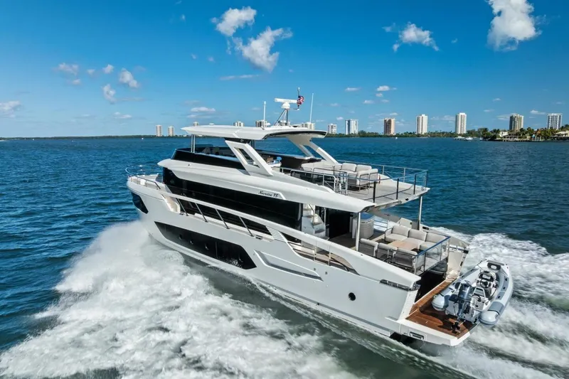 Fantasy Girl Yacht Photos Pics Luxury 2025 Absolute 75 Navetta yacht cruising on open water under clear blue skies.