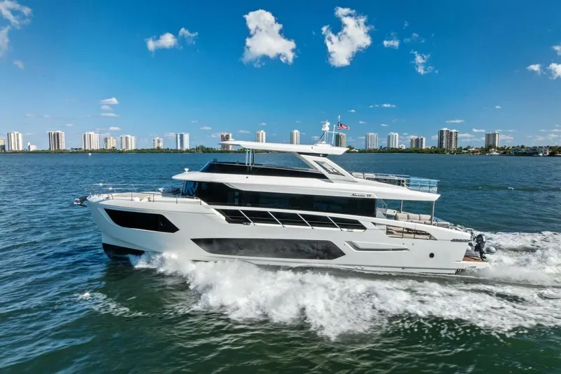 Fantasy Girl Yacht Photos Pics 2025 Absolute 75 Navetta yacht cruising on a sunny day with city skyline backdrop.