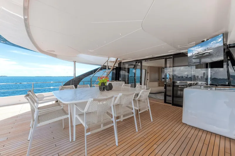  Yacht Photos Pics Luxurious deck of 2025 Azimut Grande 36M yacht with dining area and ocean view.