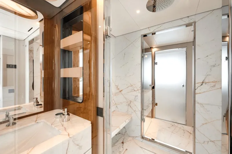  Yacht Photos Pics Luxurious marble bathroom interior on 2025 Azimut Grande 36M yacht.