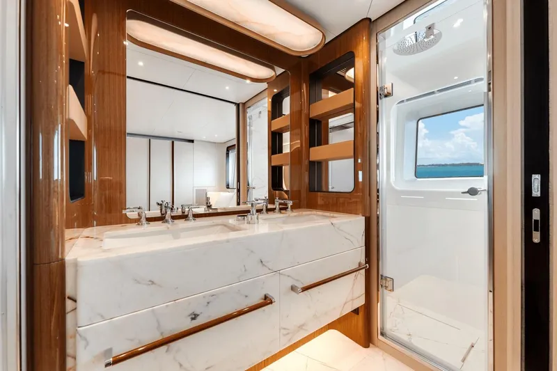  Yacht Photos Pics Luxurious bathroom in 2025 Azimut Grande 36M yacht with marble sink and ocean view.