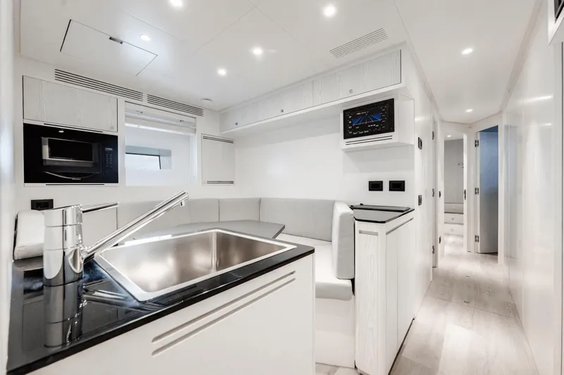  Yacht Photos Pics Luxurious interior of 2025 Azimut Grande 36M yacht with modern kitchen and seating area.