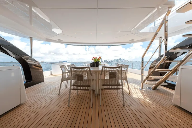  Yacht Photos Pics Luxurious deck of 2025 Azimut Grande 36M yacht with ocean view and elegant dining setup.