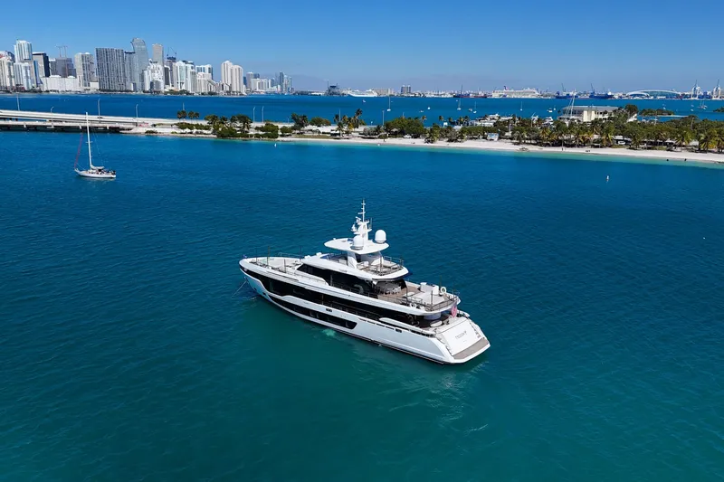  Yacht Photos Pics Luxury Azimut Grande 36M yacht cruising near a city skyline, 2025 model.