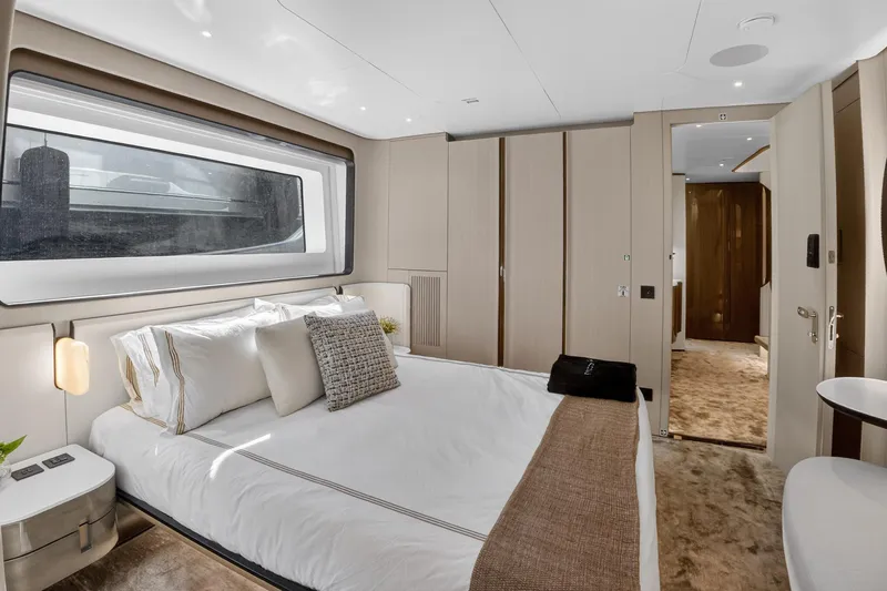  Yacht Photos Pics Luxurious bedroom interior of 2025 Azimut Grande 36M yacht, featuring modern design and elegant furnishings.