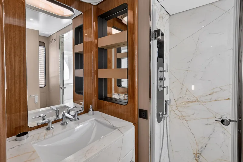 Yacht Photos Pics Luxurious bathroom in 2025 Azimut Grande 36M yacht with marble and wood finishes.