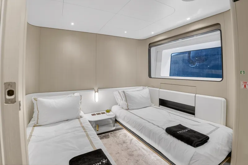  Yacht Photos Pics Luxurious twin cabin interior of 2025 Azimut Grande 36M yacht, featuring modern design and large window.
