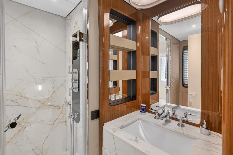  Yacht Photos Pics Luxurious bathroom in 2025 Azimut Grande 36M yacht with marble and wood finishes.