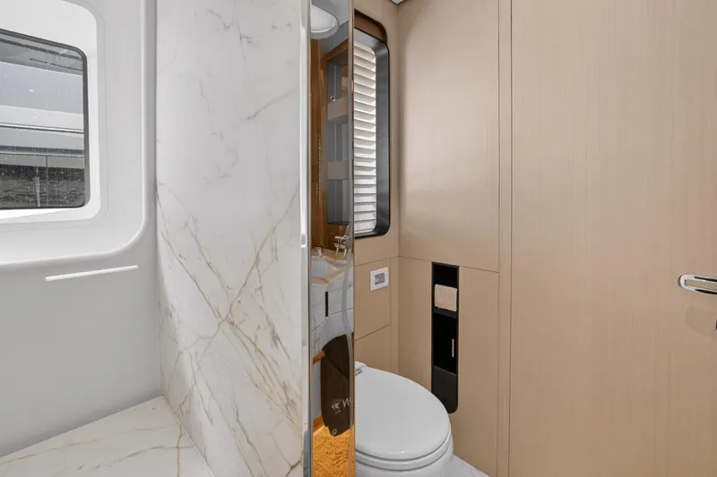  Yacht Photos Pics Luxurious bathroom interior of 2025 Azimut Grande 36M yacht with marble and wood finishes.
