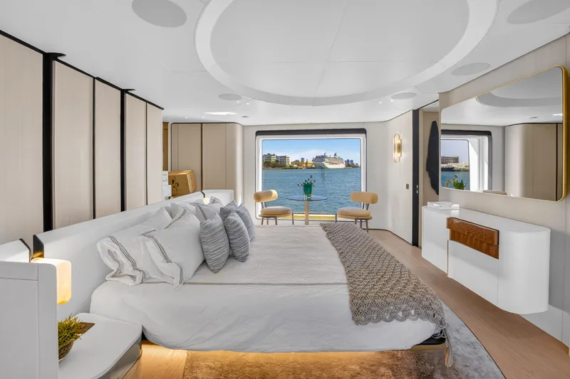  Yacht Photos Pics Luxurious bedroom interior of 2025 Azimut Grande 36M yacht with ocean view.