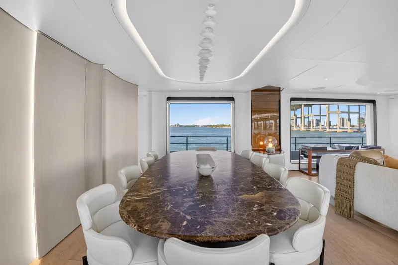  Yacht Photos Pics Luxurious dining area on 2025 Azimut Grande 36M yacht with elegant marble table and waterfront view.