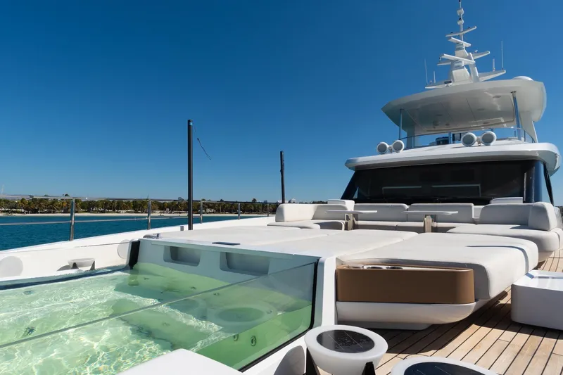  Yacht Photos Pics Luxurious 2025 Azimut Grande 36M yacht with sun deck and jacuzzi, under clear blue sky.