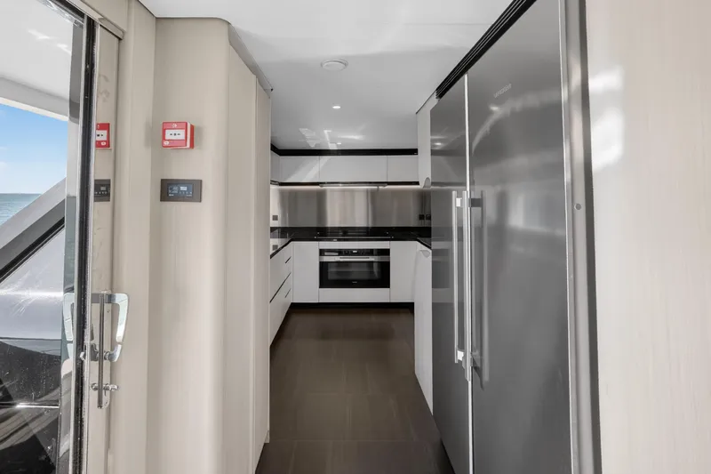  Yacht Photos Pics Modern kitchen interior on 2025 Azimut Grande 36M yacht, featuring sleek appliances and minimalist design.