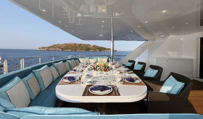  Yacht Photos Pics Luxurious dining setup on 1987 Benetti 50 CUSTOM yacht with ocean view.