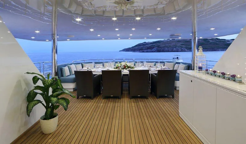  Yacht Photos Pics Luxurious dining area on 1987 Benetti 50 CUSTOM yacht with ocean view.