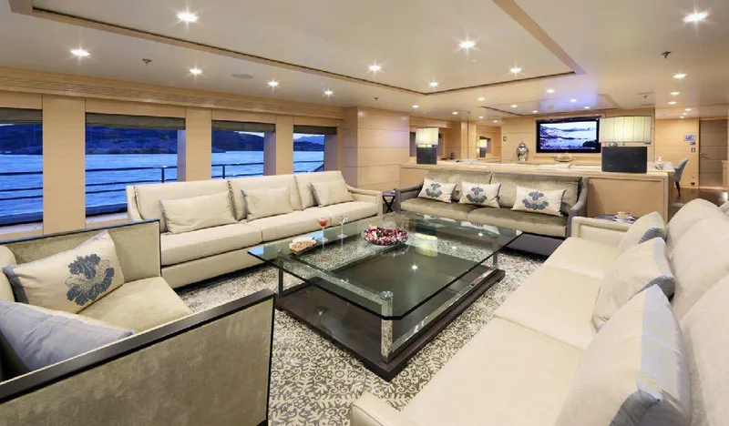  Yacht Photos Pics Luxurious interior of 1987 Benetti 50 CUSTOM yacht with elegant seating and panoramic windows.
