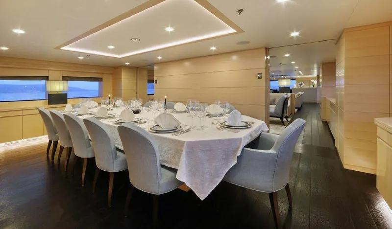  Yacht Photos Pics Luxurious dining area on a 1987 Benetti 50 CUSTOM yacht, featuring elegant table settings.