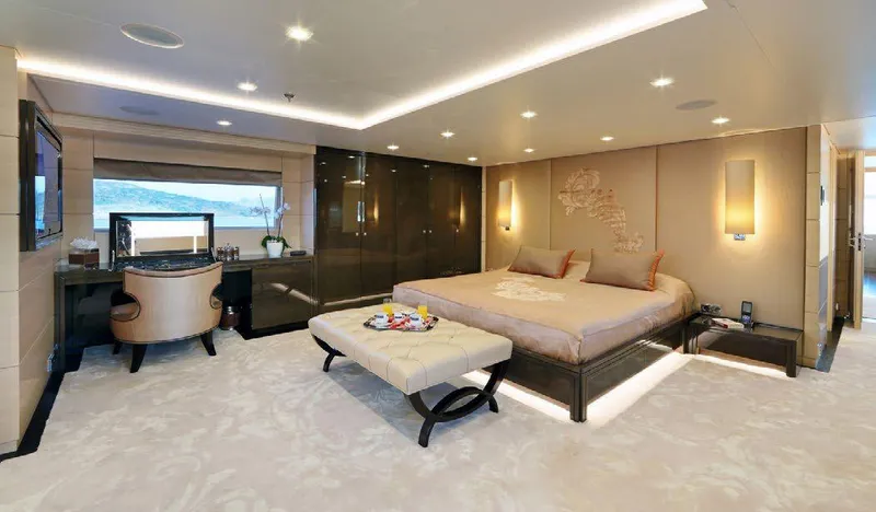  Yacht Photos Pics Luxurious bedroom interior on 1987 Benetti 50 CUSTOM yacht, featuring elegant decor and modern amenities.