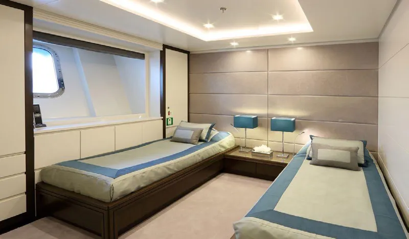  Yacht Photos Pics Luxurious twin bedroom on 1987 Benetti 50 CUSTOM yacht, featuring modern decor and ambient lighting.
