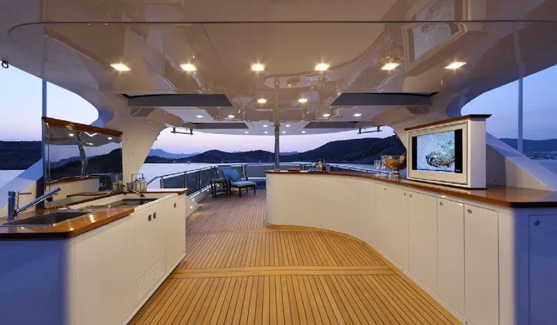  Yacht Photos Pics Luxurious deck of 1987 Benetti 50 CUSTOM yacht with modern amenities and scenic views.