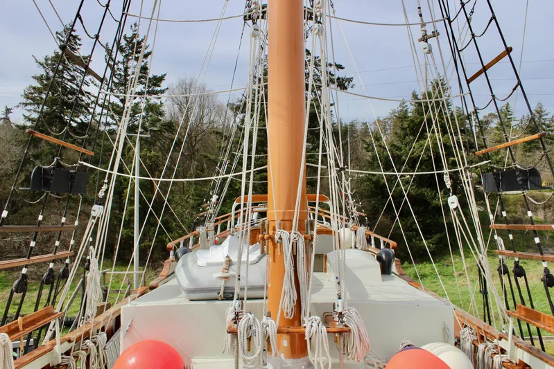Hawaiian Chieftain Yacht Photos Pics Custom Lahaina Welding Co. Square Topsail Ketch, 1988, with rigging and deck view, surrounded by trees.