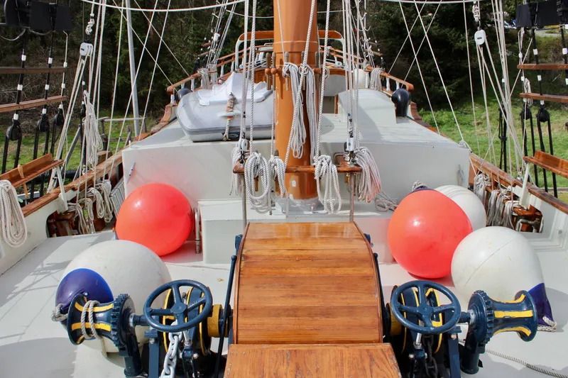 Hawaiian Chieftain Yacht Photos Pics Deck view of 1988 Custom Lahaina Welding Co. Square Topsail Ketch with colorful buoys and rigging.