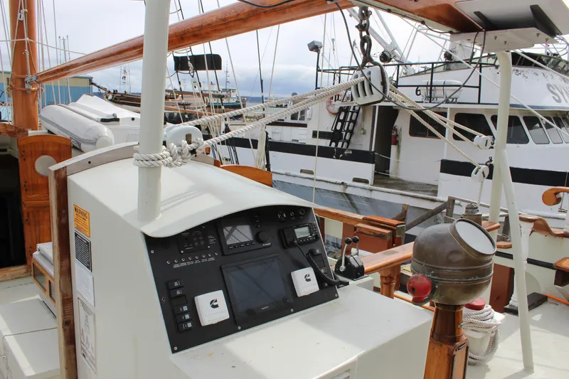 Hawaiian Chieftain Yacht Photos Pics Cockpit view of 1988 Lahaina Welding Co. Square Topsail Ketch, featuring navigation equipment and nearby boats.