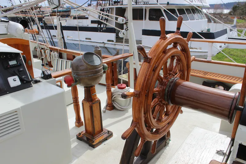 Hawaiian Chieftain Yacht Photos Pics Wooden helm and binnacle on 1988 Lahaina Welding Co. Square Topsail Ketch deck.