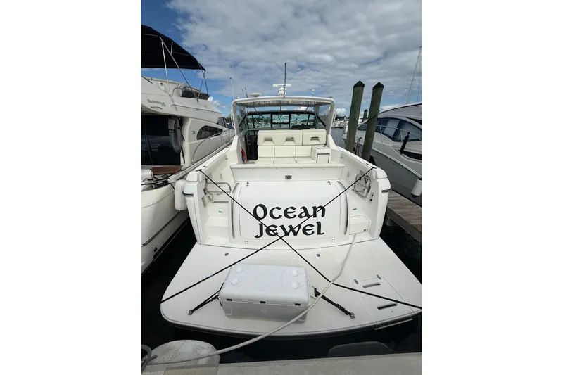  Yacht Photos Pics 1999 Tiara Yachts 4000 Express "Ocean Jewel" docked at marina under cloudy sky.