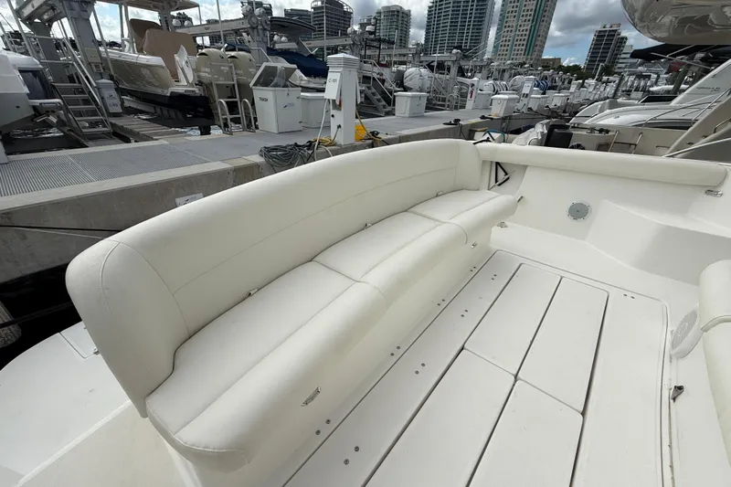  Yacht Photos Pics 1999 Tiara Yachts 4000 Express with white seating at a marina dock.