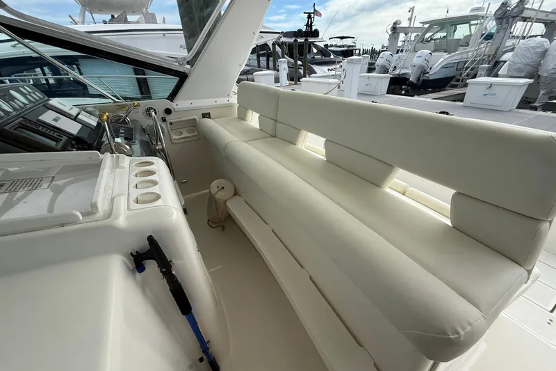  Yacht Photos Pics 1999 Tiara Yachts 4000 Express interior with white seating and control panel.