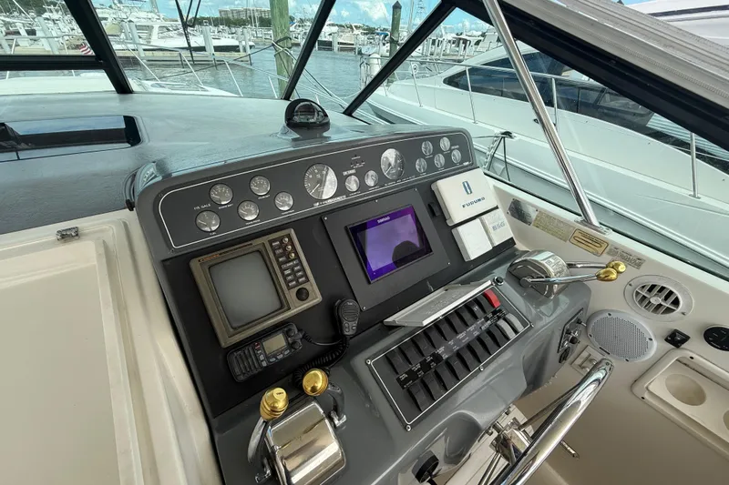  Yacht Photos Pics 1999 Tiara Yachts 4000 Express helm with navigation instruments and controls at marina.