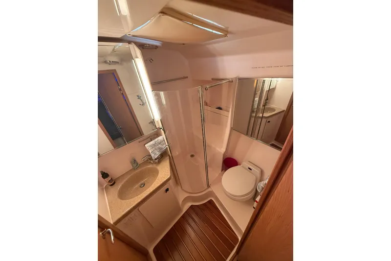  Yacht Photos Pics Bathroom interior of 1999 Tiara Yachts 4000 Express with shower and sink.