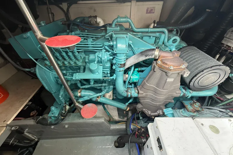  Yacht Photos Pics Engine room of a 1999 Tiara Yachts 4000 Express, showcasing detailed machinery components.