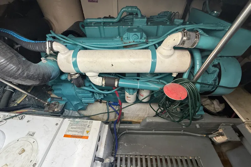  Yacht Photos Pics Engine room of a 1999 Tiara Yachts 4000 Express, showcasing mechanical components.
