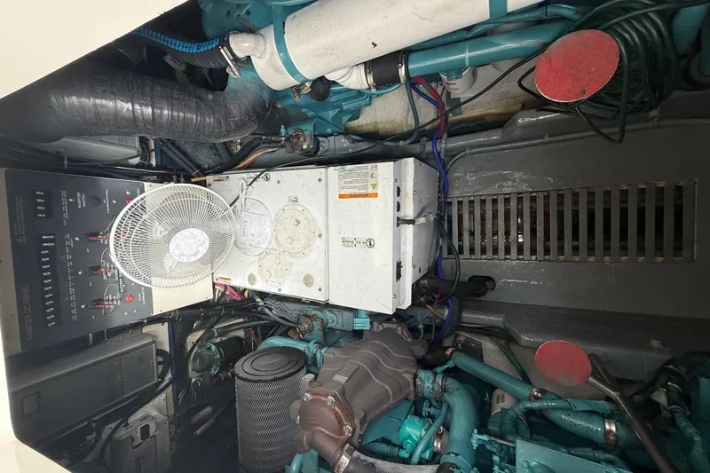  Yacht Photos Pics Engine room of a 1999 Tiara Yachts 4000 Express, showcasing mechanical components and wiring.