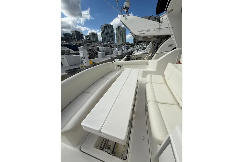 Yacht Photos Pics 1999 Tiara Yachts 4000 Express with white seating, docked in a marina.