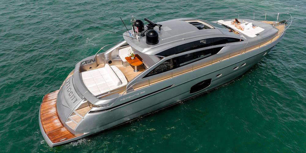 Luxurious 2015 Pershing 62' yacht cruising on open water, showcasing sleek design and elegance.