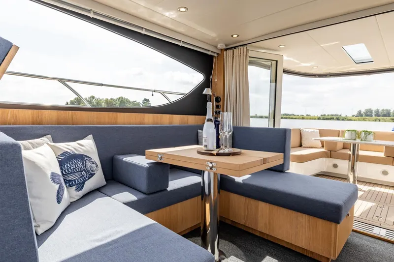  Yacht Photos Pics Luxurious interior of 2024 Vripack 42 Open Kuip yacht with elegant seating and decor.