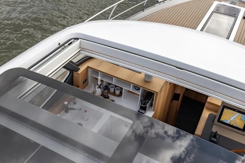  Yacht Photos Pics Luxurious interior of 2024 Vripack 42 Open Kuip yacht with modern amenities and navigation system.