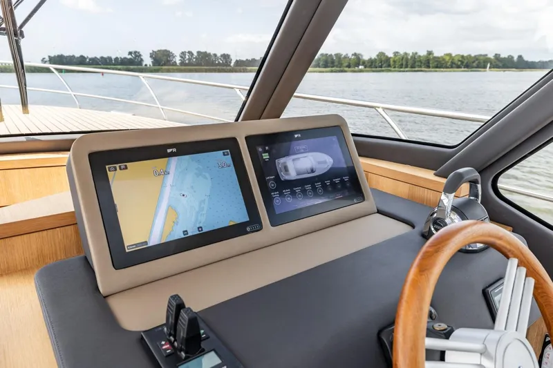  Yacht Photos Pics Cockpit of 2024 Vripack 42 Open Kuip yacht with dual navigation screens.