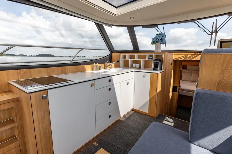  Yacht Photos Pics Modern interior of 2024 Vripack 42 Open Kuip yacht with sleek kitchen design.