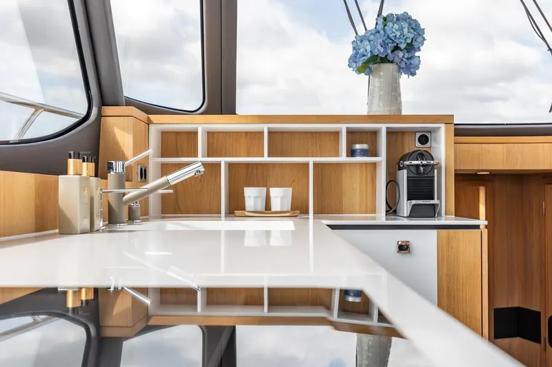  Yacht Photos Pics Luxurious interior of 2024 Vripack 42 Open Kuip yacht with modern kitchen amenities.