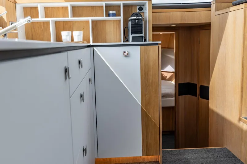  Yacht Photos Pics Modern interior of 2024 Vripack 42 Open Kuip yacht with sleek cabinetry and cozy cabin.