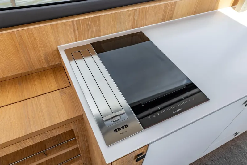  Yacht Photos Pics Modern kitchen setup on 2024 Vripack 42 Open Kuip yacht with Siemens cooktop.
