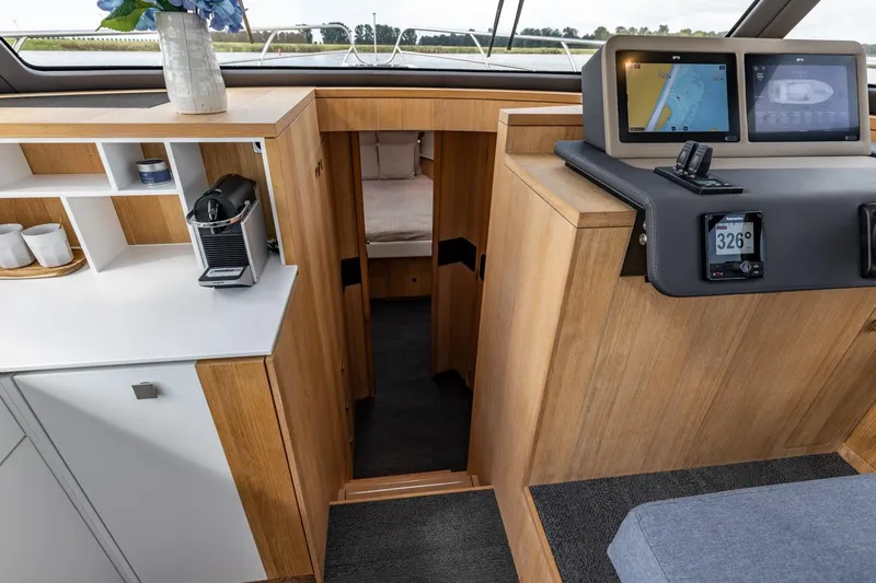 Yacht Photos Pics Modern interior of 2024 Vripack 42 Open Kuip yacht with navigation screens and coffee station.
