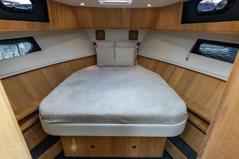  Yacht Photos Pics Luxurious cabin interior of 2024 Vripack 42 Open Kuip yacht with cozy bedding.