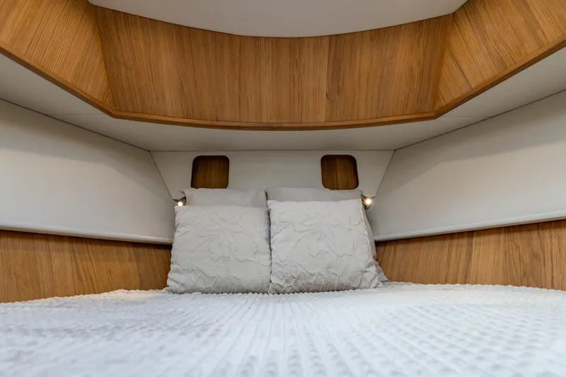  Yacht Photos Pics Cozy cabin interior of 2024 Vripack 42 Open Kuip yacht with wooden accents.